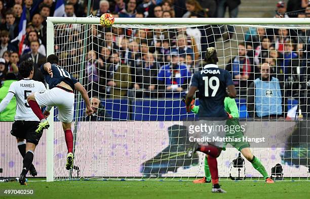 Andre-Pierre Gignac of France scores his side's second goal during the International Friendly match between France and Germany at the Stade de France...