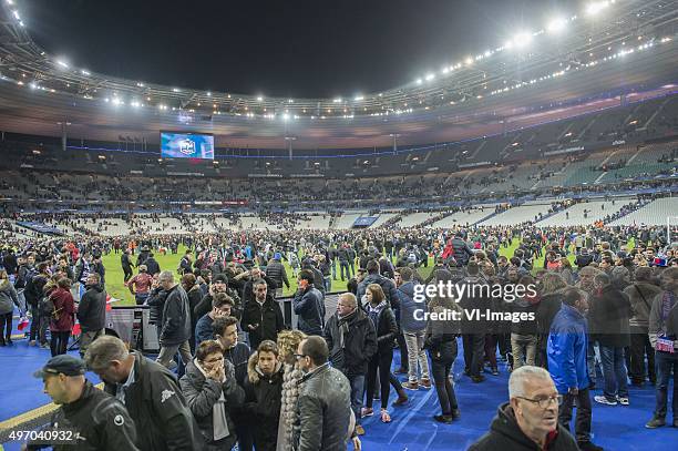 Supporters run in panic on the pitch during the International friendly match between France and Germany on November 13, 2015 at the Stade France in...