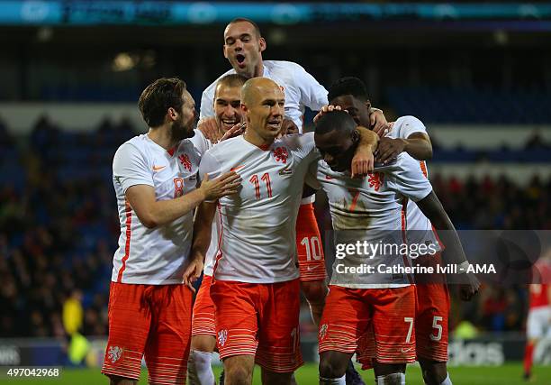 Arjen Robben of Netherlands celebrates after he scores a goal to make it 1-2 during the International Friendly match between Wales and Netherlands at...