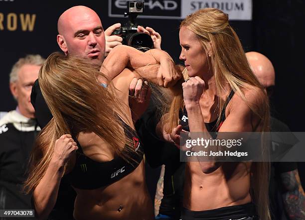 Opponents Ronda Rousey of the United States and Holly Holm of the United States face off during the UFC 193 weigh-in at Etihad Stadium on November...