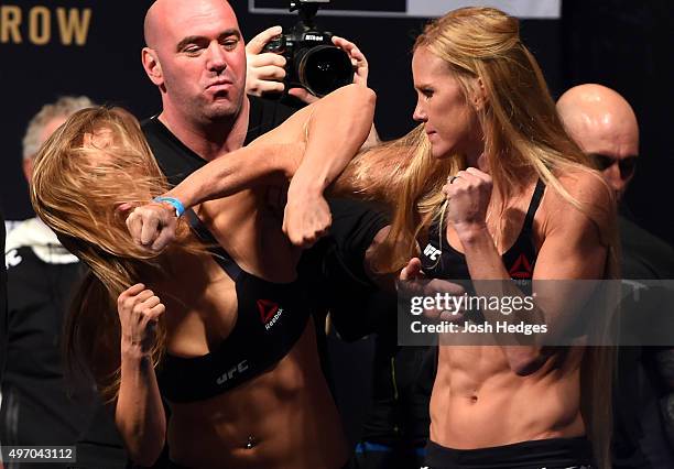 Opponents Ronda Rousey of the United States and Holly Holm of the United States face off during the UFC 193 weigh-in at Etihad Stadium on November...