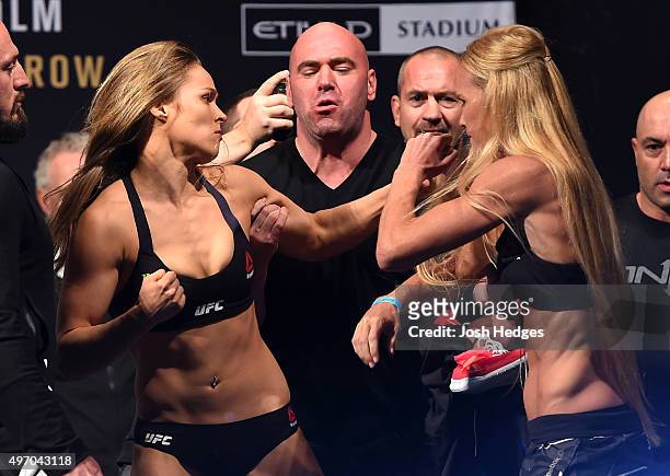 Opponents Ronda Rousey of the United States and Holly Holm of the United States face off during the UFC 193 weigh-in at Etihad Stadium on November...