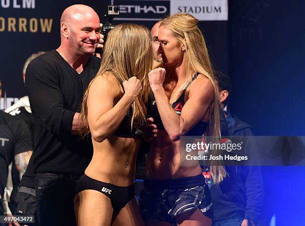 Opponents Ronda Rousey of the United States and Holly Holm of the United States face off during the UFC 193 weigh-in at Etihad Stadium on November...