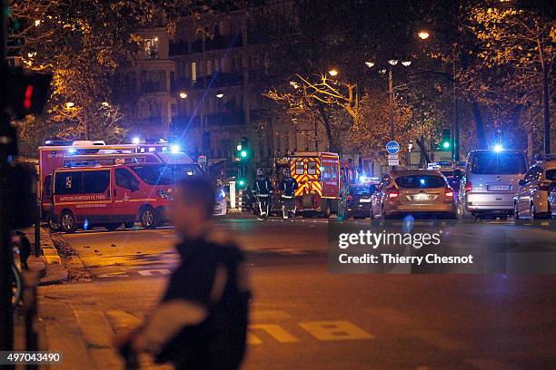 Police survey the area of Boulevard Baumarchais after an attack in the French capital on November 13, 2015 in Paris, France. At least 18 people were...