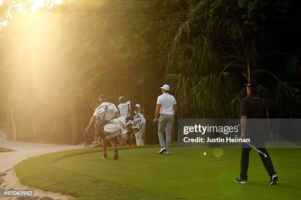 Luke List and Derek Fathauer of the United States walk off the 8th green during the second round of the OHL Classic at the Mayakoba El Camaleon Golf...