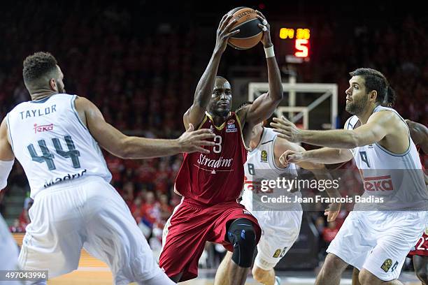 Rodrigue Beaubois, #3 of Strasbourg competes with Jeffery Taylor, #44 of Real Madrid and Felipe Reyes, #9 of Real Madridduring Regular Season date 5...