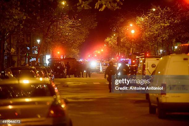 Policemen patrol the streets during gunfire near the Bataclan concert hall on November 13, 2015 in Paris, France. Gunfire and explosions in multiple...