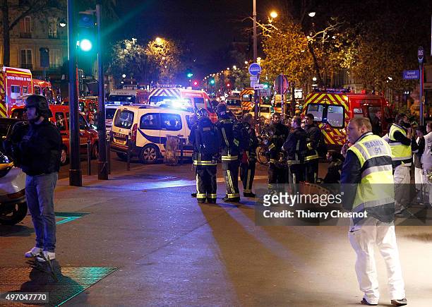 Police and medics gather near the Boulevard des Filles-du-Calvaire after an attack November 13, 2015 in Paris, France. Gunfire and explosions in...