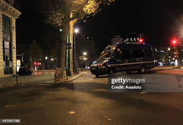 French police officers take security measures around the the Republic Square in Paris, France on November 13 after deadly shootings and explosions...