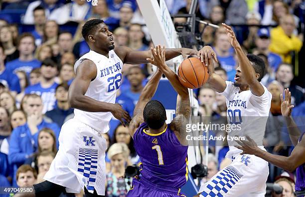 Alex Poythress and Marcus Lee of the Kentucky Wildcats defend the shot of Ray Sanders of the Albany Great Danes at Rupp Arena on November 13, 2015 in...