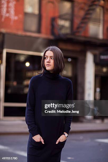 Vintage Vice Blogger and stylist Emma Sousa wears a dark blue Whistles sweater dress, and a Nicholas Keith watch in the Lower East Side on November...