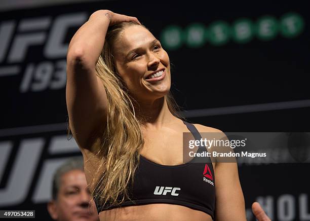 Women's bantamweight champion Ronda Rousey of the United States steps off the scale during the UFC 193 weigh-in at Etihad Stadium on November 14,...
