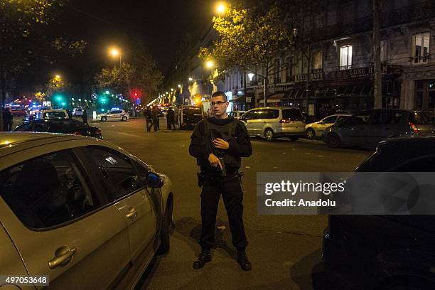 French police officers take security measures around the Bataclan concert hall in Paris, France on November 13 after deadly shootings and explosions...