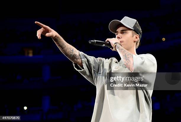 Singer/songwriter Justin Bieber performs onstage during an evening with Justin Bieber to celebrate the release of "Purpose" at Staples Center on...