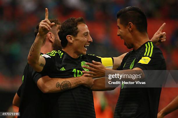 Andres Guardado of Mexico celebrates with teammates after scoring the first goal of his team during the match between Mexico and El Salvador as part...
