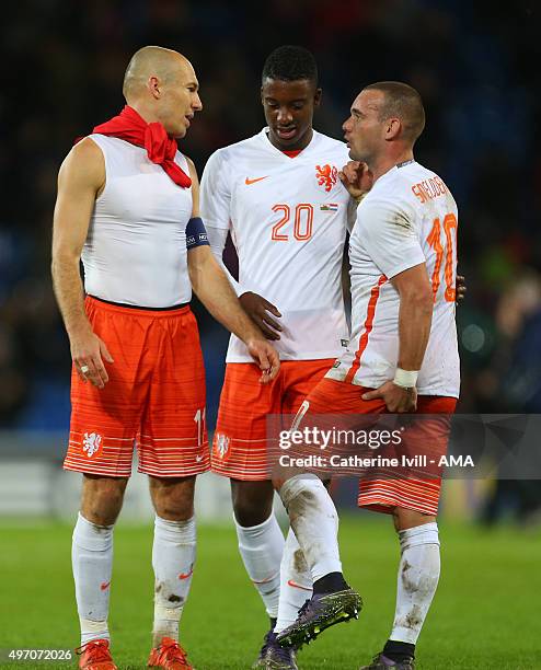 Arjen Robben of Netherlands with team mates Riechedly Bazoer and Wesley Sneijder after the International Friendly match between Wales and Netherlands...