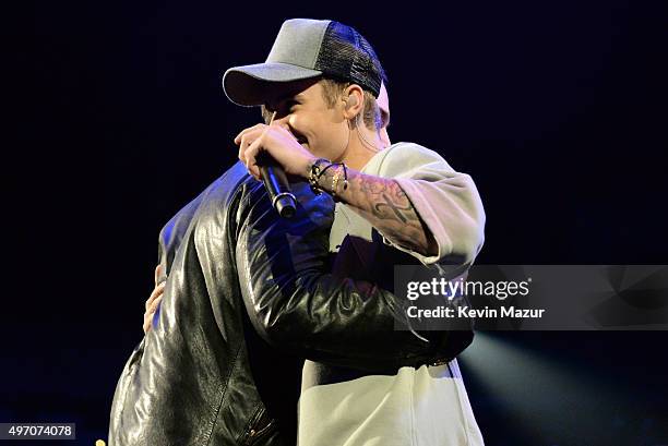 Manager Scooter Braun and singer/songwriter Justin Bieber speak onstage during an evening with Justin Bieber to celebrate the release of his new...