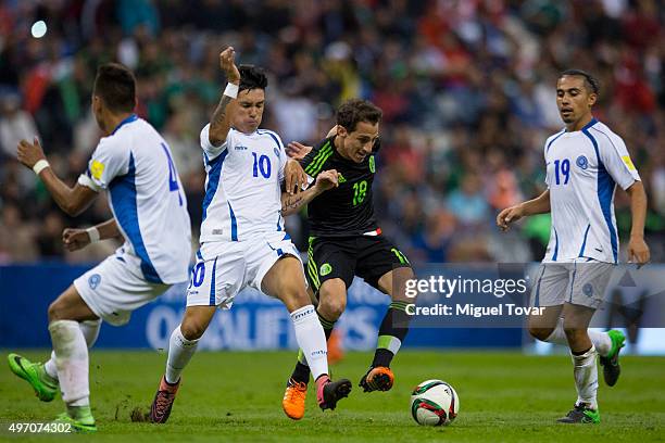 Andres Guardado of Mexico fights for the ball with Jaime Alas of El Salvador during the match between Mexico and El Salvador as part of the 2018 FIFA...