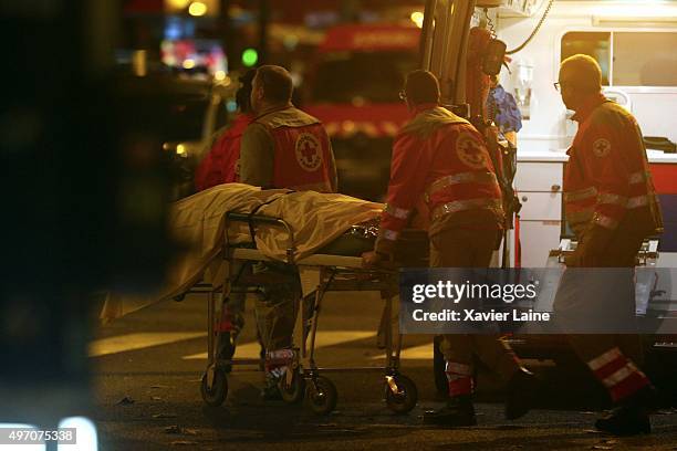 Paramedics remove bodies from outside the Bataclan concert hall after an attack on November 13, 2015 in Paris, France. According to reports, over 150...