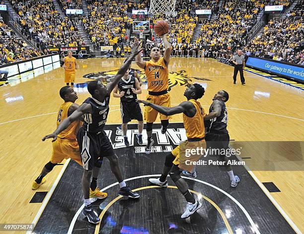 Guard John Robert Simon of the Wichita State Shockers drives through the lane and scores against the Charleston Southern Buccaneers during the second...