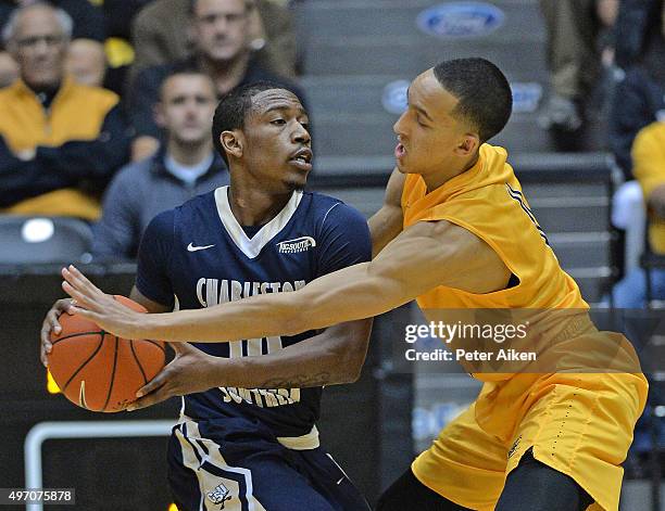 Guard Landry Shamet of the Wichita State Shockers defends guard Danny Upchurch of the Charleston Southern Buccaneers during the first half on...