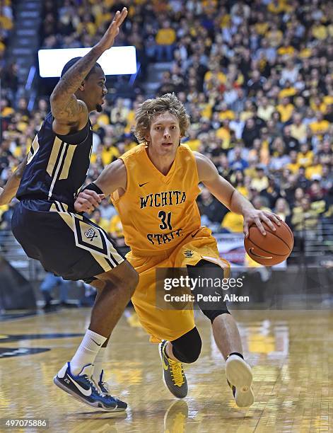 Guard Ron Baker of the Wichita State Shockers drives with the ball against the Charleston Southern Buccaneers during the first half on November 13,...