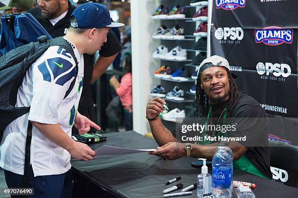 Seattle Seahawks Running Back Marshawn Lynch attends in store appearance for the launch of BEASTMODE x PSD at Champs at Bellevue Square on November...