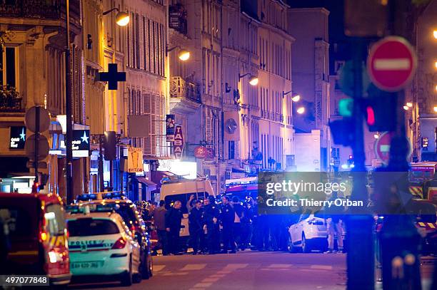 Officials investigate the scene outside the Bataclan concert hall after an attack on November 13, 2015 in Paris, France. According to reports, over...