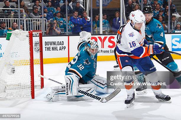 Alex Stalock and Brenden Dillon of the San Jose Sharks protect the net against Steve Bernier of the New York Islanders at SAP Center on November 10,...