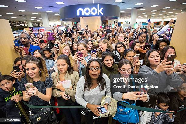 Fans attend a book signing for Khloe Kardashian as she signs and discusses her new book "Strong Looks Better Naked" at Barnes & Noble on November 13,...