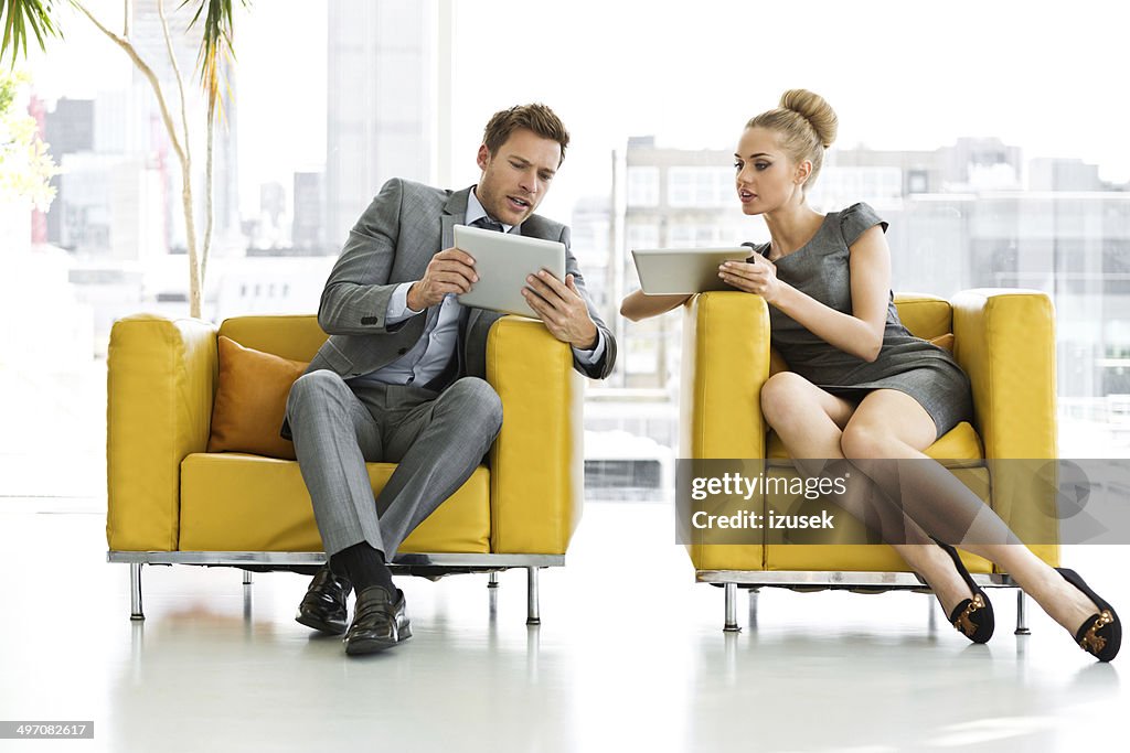 Business people with digital tablets