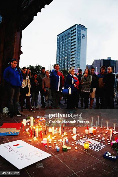 People gather during a vigil in Aotea Square to remember victims of the Paris attacks on November 14, 2015 in Auckland, New Zealand. According to...