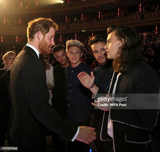 Britain's Prince Harry greets members of One Direction after the Royal Variety Performance at the Albert Hall on November 13, 2015 in London, England.