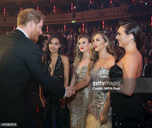 Britain's Prince Harry greets members of Little Mix after the Royal Variety Performance at the Albert Hall on November 13, 2015 in London, England.