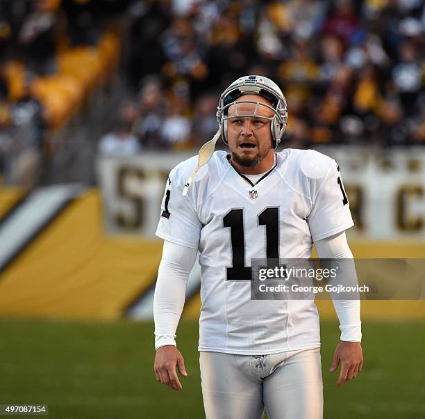 Kicker Sebastian Janikowski of the Oakland Raiders looks on from the sideline during a game against the Pittsburgh Steelers at Heinz Field on...