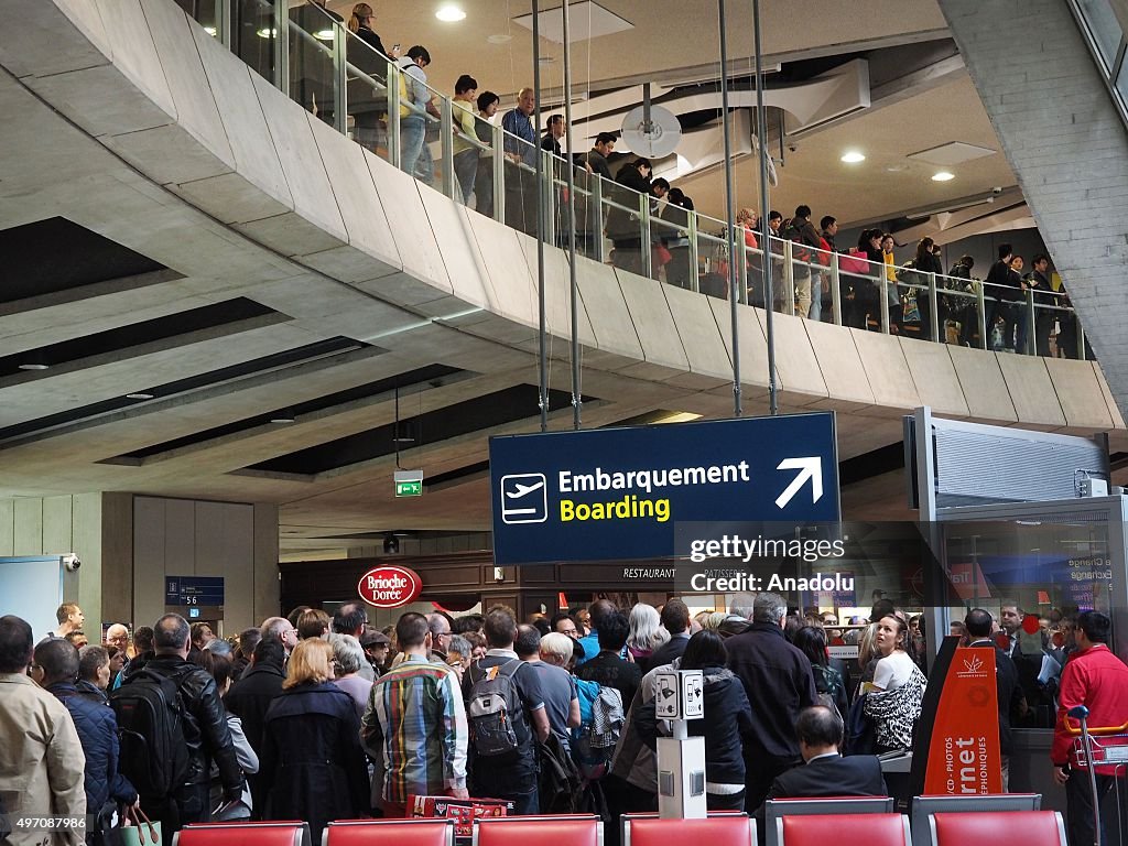 Tourists swarm in Charles De Gaulle airport following terrorist attacks in Paris