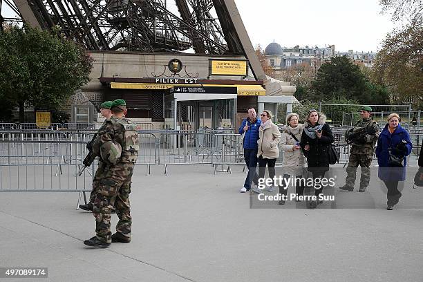 Ambiance outside the Arc De Triomphe as soldiers patrol in front of the Arc De Triomphe on November 14, 2015 in Paris, France. At least 120 people...