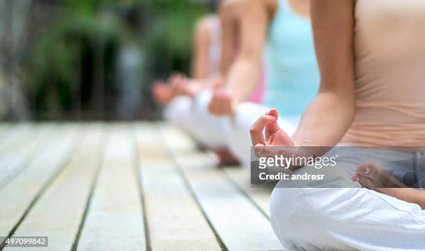 people doing yoga - hälsosalong bildbanksfoton och bilder