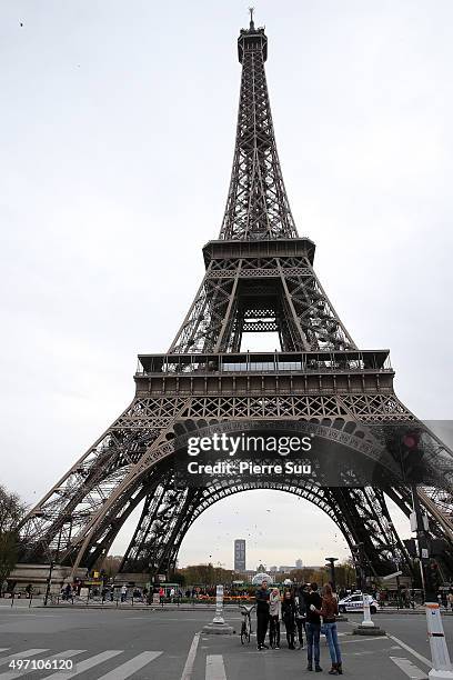 Ambiance outside the Eiffel Tower on November 14, 2015 in Paris, France. At least 120 people have been killed and over 200 injured, 80 of which...