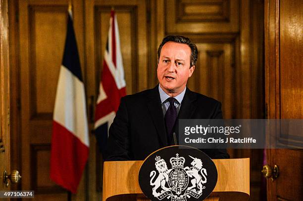 British Prime Minister David Cameron speaks in the State Dining Room of 10 Downing Street after chairing an emergency Cobra meeting on November 14,...