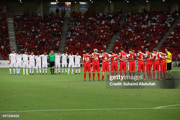 Liverpool and Manchester United legends observe a minute of silence to remember the Paris attacks before The Castlewood Group Battle Of The Reds 2015...