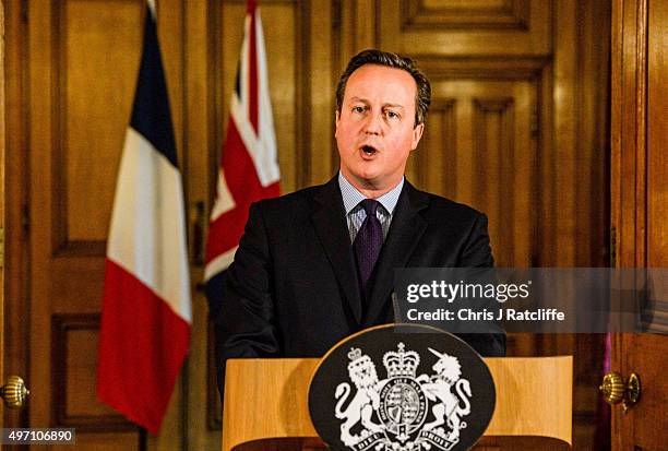 British Prime Minister David Cameron speaks in the State Dining Room of 10 Downing Street after chairing an emergency Cobra meeting on November 14,...