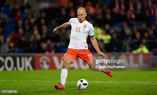 Netherlands players Arjen Robben scores the third Dutch goal during the friendly International match between Wales and Netherlands at Cardiff City...