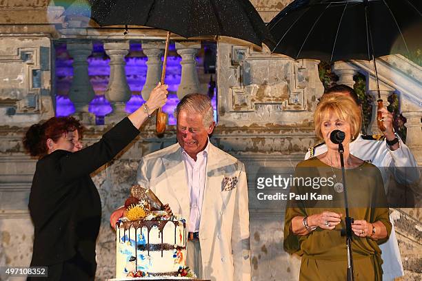 Prince Charles, Prince of Wales cuts his bithday cake during a reception with Camilla, Duchess of Cornwall to celebrate the Prince's birthday at the...