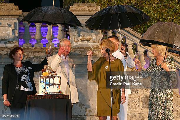 Prince Charles, Prince of Wales and West Australian Governor Kerry Sanderson make a toast during a reception with Camilla, Duchess of Cornwall to...