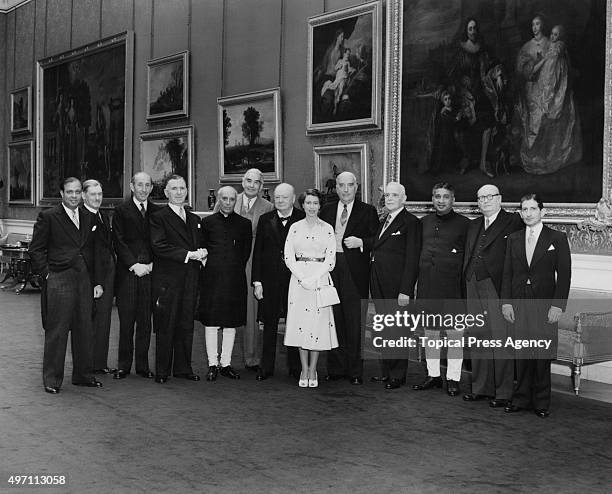 Queen Elizabeth II with her Dominion Prime Ministers and Alexander Bustamante, 1st Chief Minister of Jamaica, after a lunch party given by the Queen...