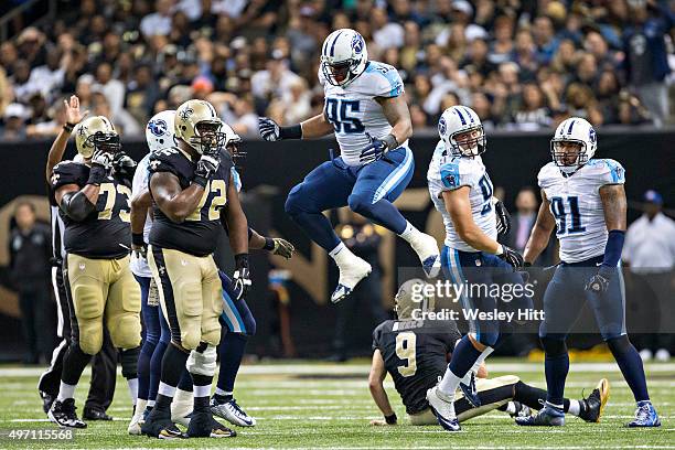 Angelo Blackson of the Tennessee Titans jumps in the air in celebration after sacking Drew Brees of the New Orleans Saints at Mercedes-Benz Superdome...