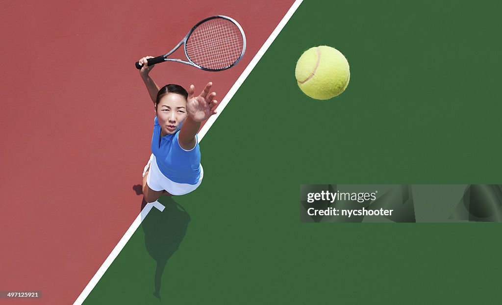 Woman tennis player serving
