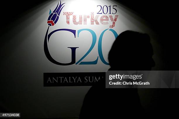 Man walks past a G20 Summit sign ahead of the start of the G20 Turkey Leaders Summit on November 14, 2015 in Antalya, Turkey. World leaders,...