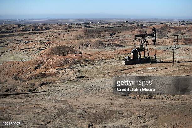 An oil rig sits on a hillside on November 14, 2015 near Derek, in Rojava, Syria. Rojava is pumping the oil and then crudely refining into diesel fuel...